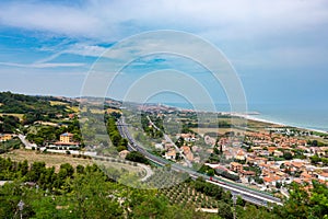 Vista from Torre di Palme to the villages of Marina Palmense and Santa Maria a Mare, over the E55 highway in Marche region in photo