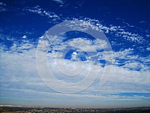 VISTA WITH A WIDE CLOUD EXPANSE IN A BLUE SKY photo