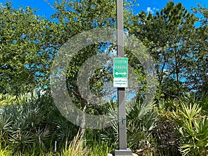 A vistors parking sign in a parking lot photo