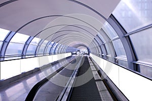 Visual mockup for advertising banner display on moving walkway travelator in long pedestrain tunnel. Blank billboard advertising