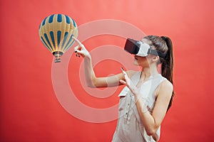 Visual reality concept. Young man using Visual reality or VR headset and interacting with object.