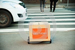 Visualization of the concept of food delivery in the city with the help of an artificial intelligence robot. Delivery robot