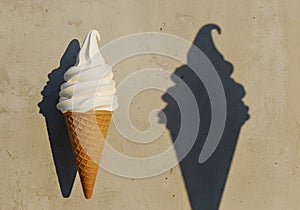 Vanilla Soft-Serve Ice Cream Cone with Dramatic Shadow â Playful Light and Summer Dessert Concept