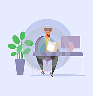 Office worker reading. Modern work culture.