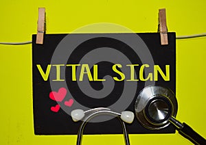 VITAL SIGN on top of yellow background