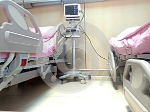 Vital signs monitoring display in ICU showing heart rate, pulse , and blood pressure . Modern medical monitor with ECG