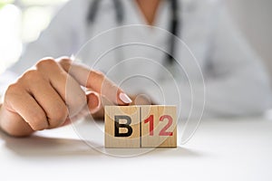 Vitamin B12. Medical Doctor Hand photo