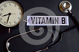 Vitamin B on the paper with Healthcare Concept Inspiration. alarm clock, Black stethoscope.