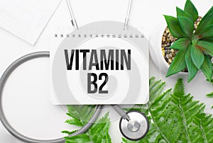 Vitamin b2 word on notebook,stethoscope and green plant