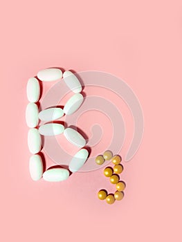 Vitamin B3 is laid out in tablets. niacin, nicotinic acid, PP. Photo top view. pink.