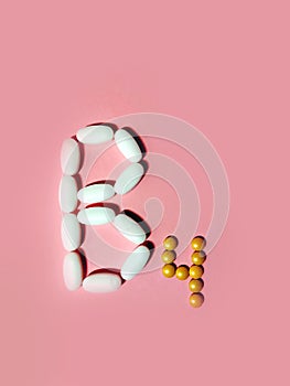 Vitamin B4 is laid out in tablets. choline. Photo top view. pink.