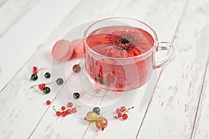 Vitamin Berry Tea. Illness concept: Cup of tea with berries currant .Drink with vitamin c. Spring and summer card. Healthy Diet.