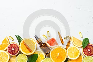 Vitamin C. Cosmetic products and fresh citrus fruits.