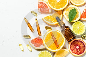 Vitamin C. Cosmetic products and fresh citrus fruits.