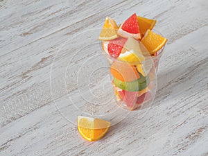 Vitamin C drink. Citrus slices in a clear glass. Strengthening the immune system concept