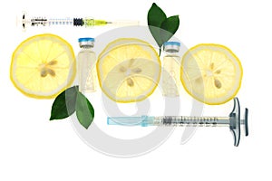 Vitamin C.Health and beauty concept.Glass apmules, syringes and lemon slices isolated on white background. prevention of