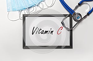 Vitamin C inscription, health care with vitamines