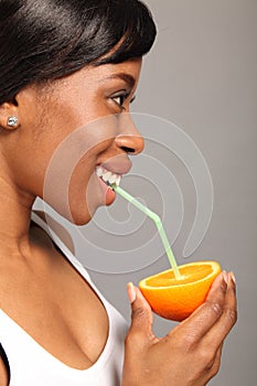 Vitamin C orange fruit drink for black woman