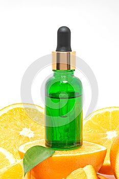 vitamin c serum bottle with cut oranges on white background. Product cosmetics ad poster mockup.