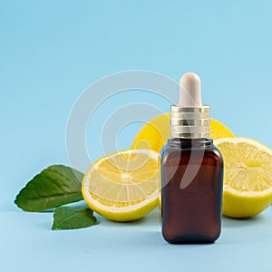 Vitamin C serum, citrus fruit essential oil. beauty care. Fresh lemons bio oil. Organic bio cosmetics with vitamin C