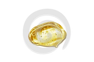 Vitamin C serum, cosmetic gel texture. Transparent yellow gel with bubbles in a beautiful smear