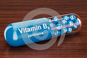 Vitamin capsule B6 on the wooden table. 3D rendering