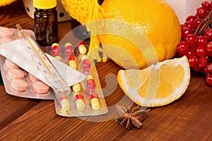 Vitamin concept - close up of lemon and pills