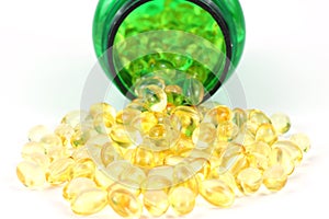 Vitamin D-3 capsules with green pill bottle photo