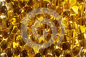 Vitamin D or cholecalciferol in olive oil capsules on the white background