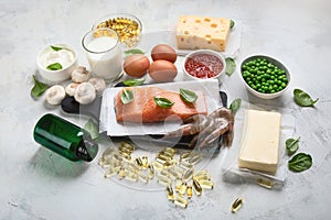 Vitamin D foods and capsulas photo