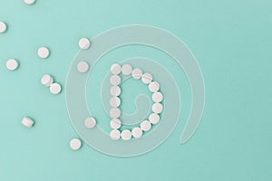 Vitamin D Pills Forming the Letter `D`