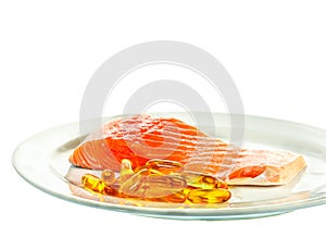 Vitamin D with salmon on white background