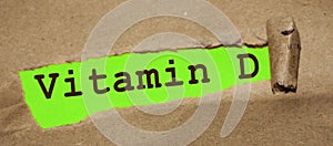 vitamin d written under torn brown paper. Healthcare concept