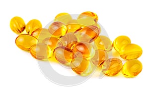 Vitamin E capsules on white closeup