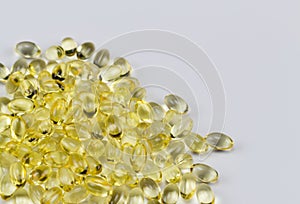 Vitamin E Pills Capsules White Background close tight view crop pile