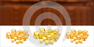 Vitamin E supplements on white background