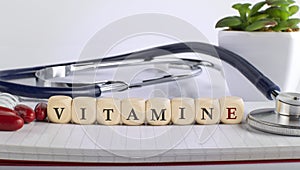 VITAMIN E word made with building blocks, medical concept background