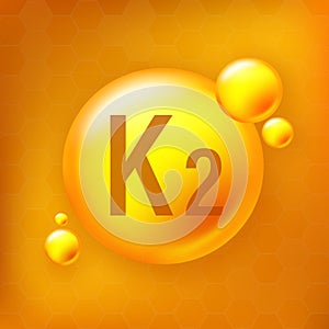 Vitamin K2 gold shining pill capcule icon. Pill capcule vector illustration on yellow isolated background
