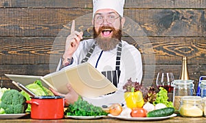 Vitamin. man use kitchenware. Dieting with organic food. Fresh vegetables. Happy bearded man cooking in kitchen