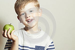 Vitamin.Smiling Child with apple.Little Boy with green apple.Health food. Fruits
