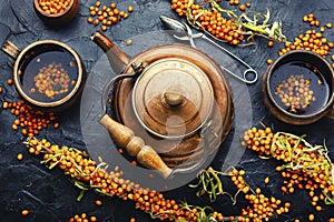 Vitamin tea with sea buckthorn photo