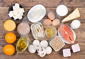 Vitamine D food sources, top view on wooden background