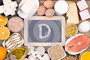 Vitamine D food sources, top view on wooden background photo