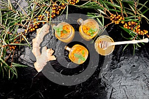 Vitaminic healthy sea buckthorn tea in small glass cups