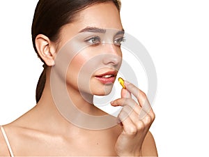 Beautiful Girl With Pill With Cod Liver Oil Omega-3 photo