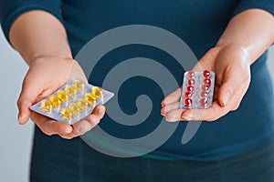 Vitamins And Dietary Supplements. Woman Holding Vitamin Pill In Hand. Closeup Of Happy Girl Taking Medication