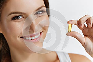 Vitamins. Healthy Eating. Happy Girl With Omega-3 Fish Oil Caps