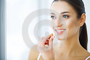 Vitamins. Healthy Eating. Happy Girl With Omega-3 Fish Oil Capsule. Healthy Diet Concept.