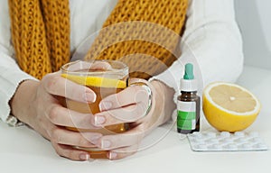 Vitamins, medicines and hot lemon tea