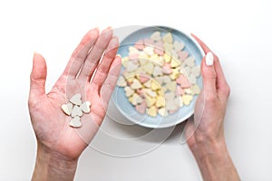 Vitamins or mineral pills on palm